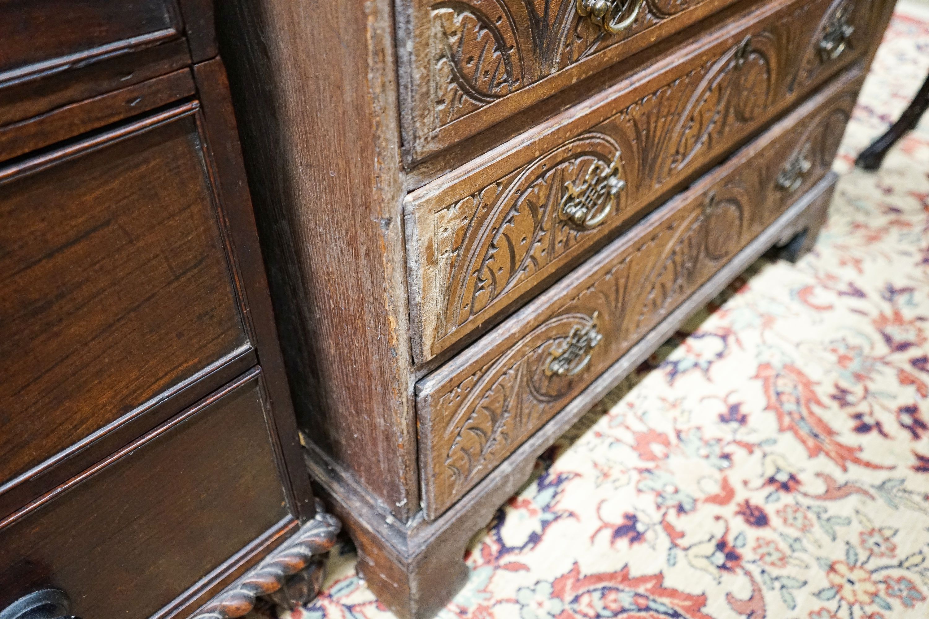 A George III later carved oak bureau, width 91cm, depth 50cm, height 106cm